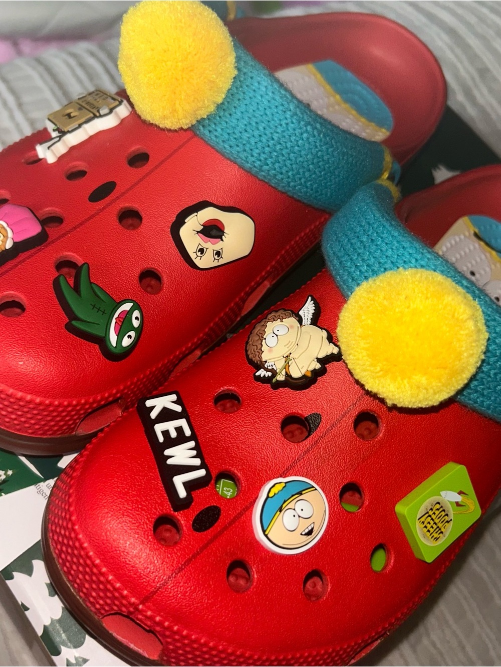 CROCS Red Clogs with Teal Heel Straps and Yellow Pom-Poms
